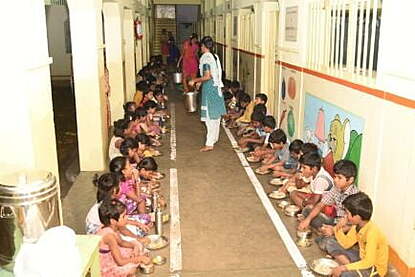 Feeding the children at free tuition centre