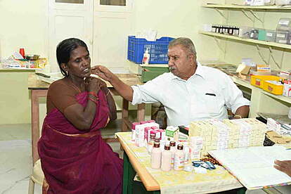 Doctor examining patient at charitable dispensary